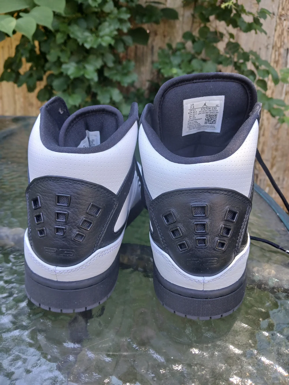 Jordan Men’s White and Black Mid-Top Sneakers with Jumpman Logo